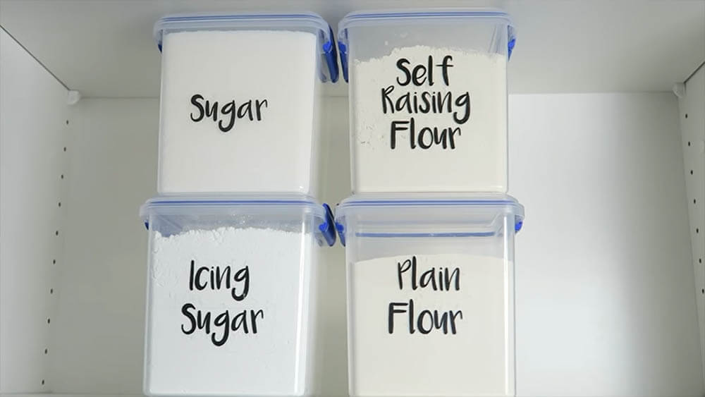 Labeled plastic containers In kitchen Cabinet