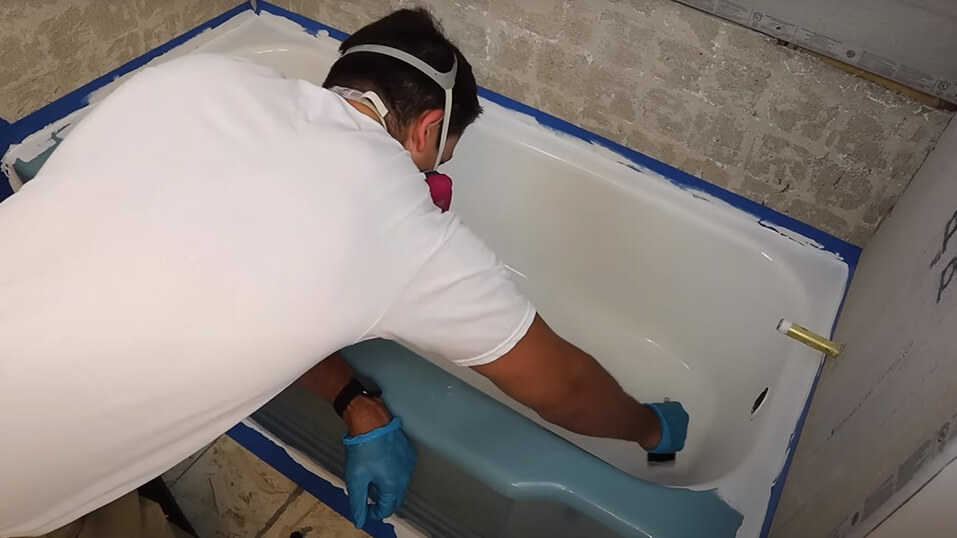 Man Applying the primer in tub