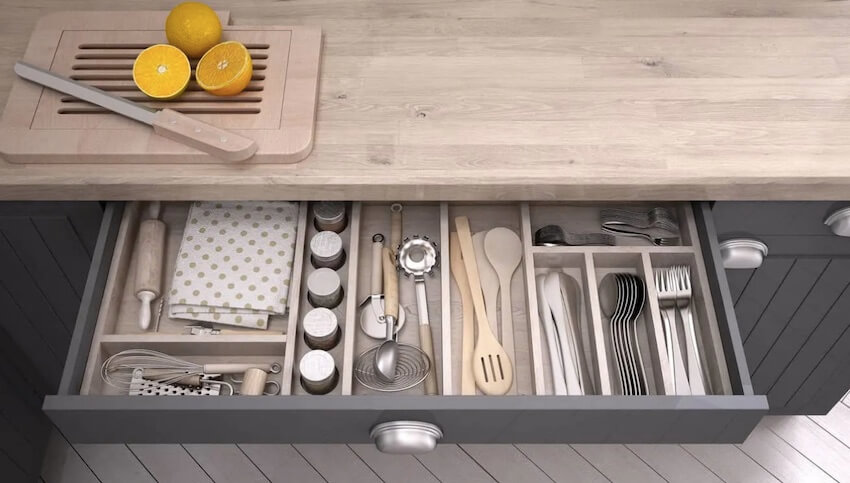 showing utensils nicely laid out in island drawer