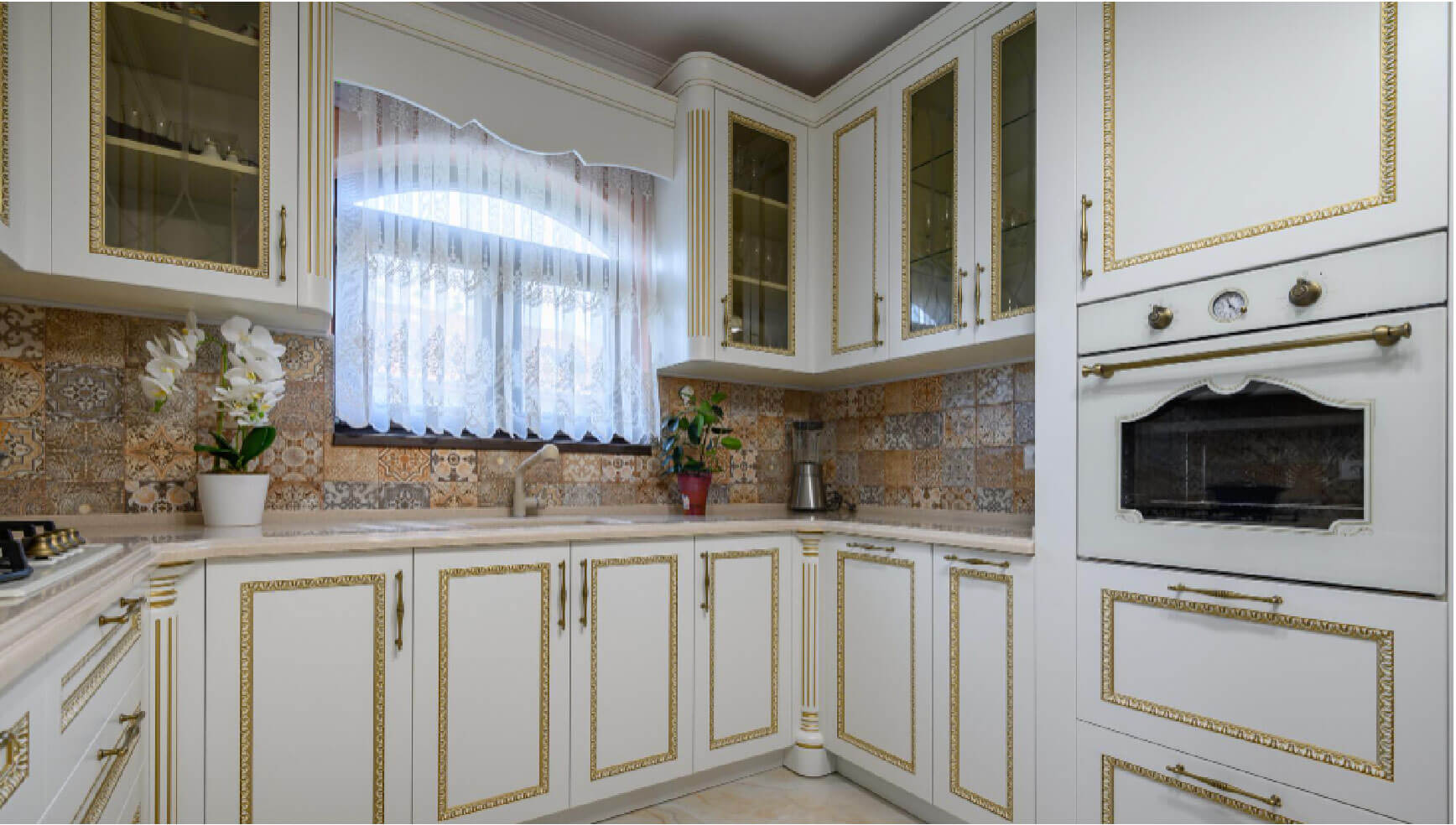 Mediterranean Kitchen with white cabinets